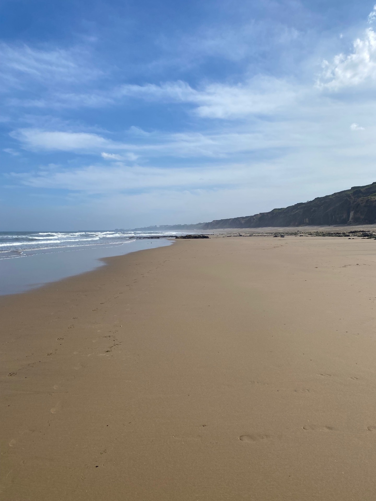 Seaham's sandy beach with cliffs and the North Sea